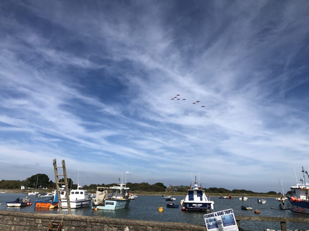 planes flying past boats