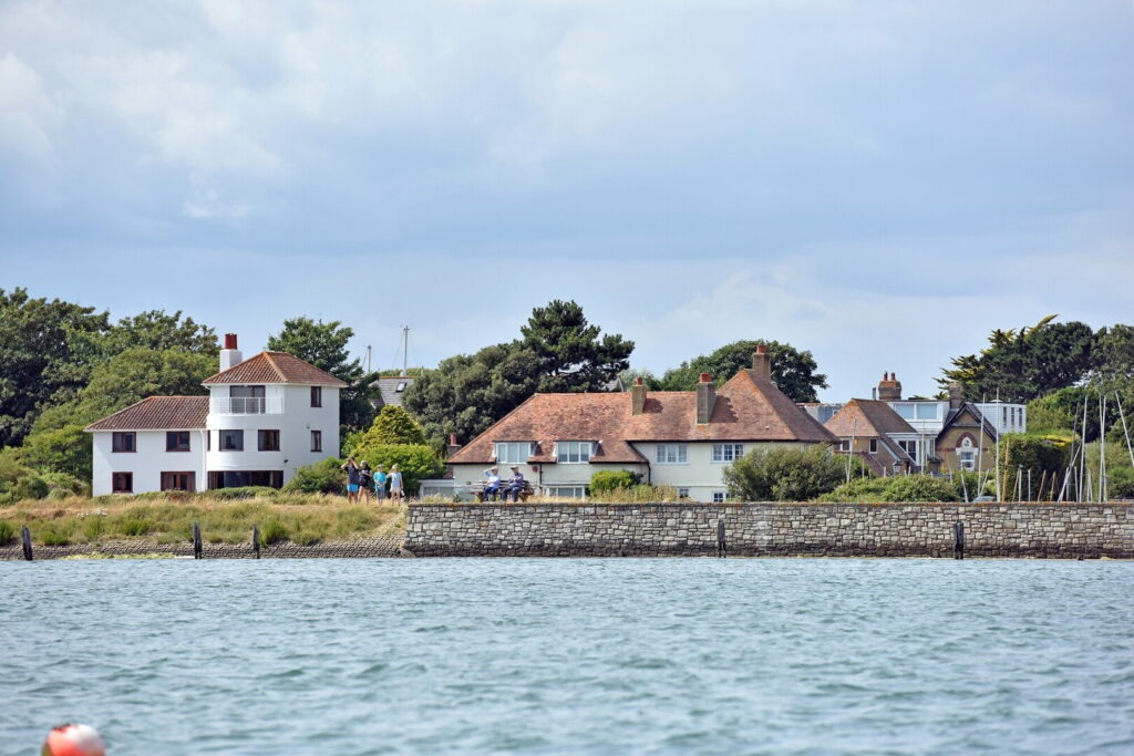houses behind a wall at the beach