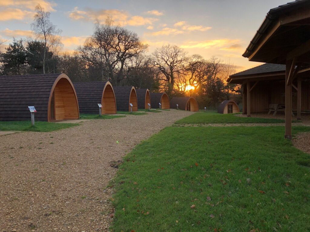 A row of small huts at sunset