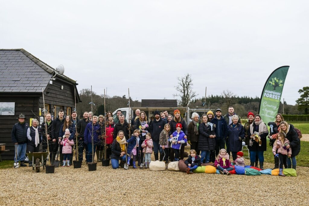 a group of people outside with a banner