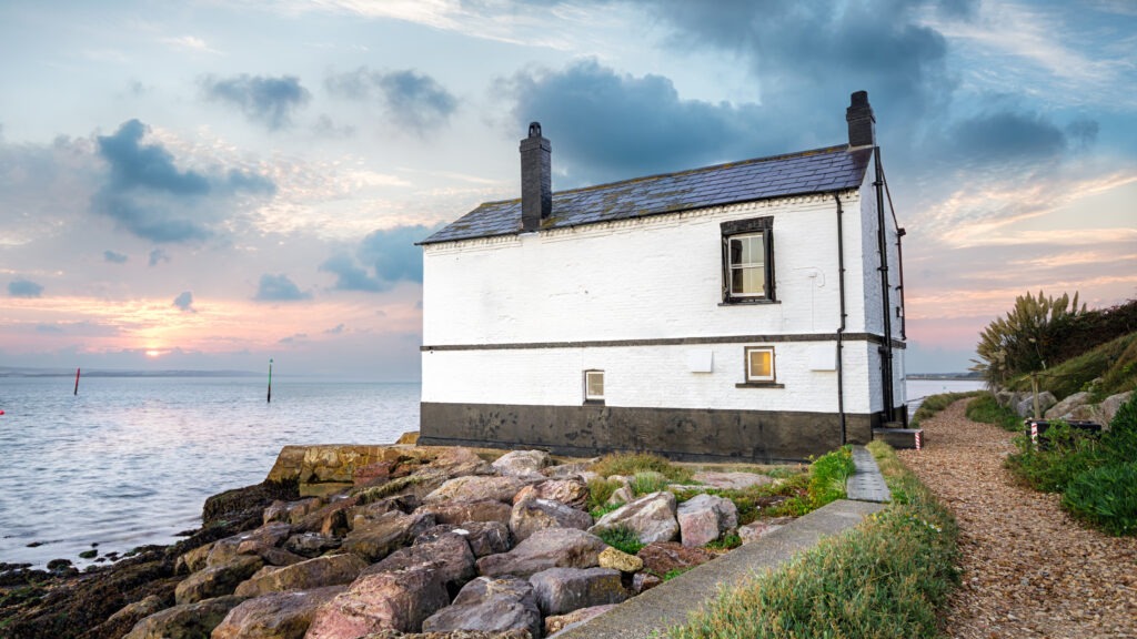 Sunrise over a cottage on the beach