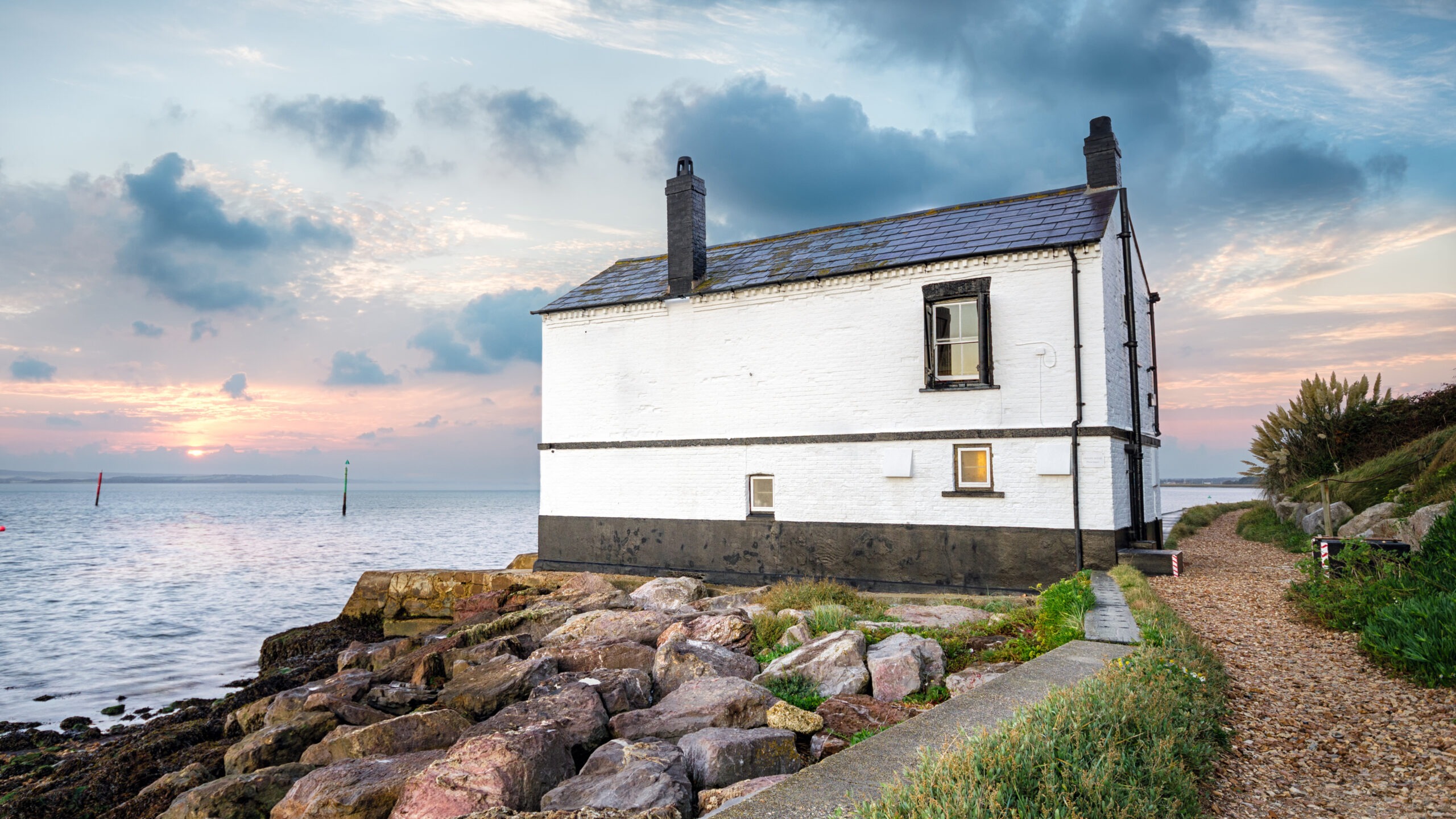 Sunrise over a cottage on the beach