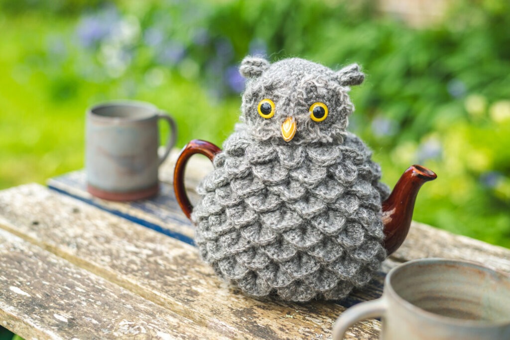 Hollyhock Flock knitted owl tea cosy