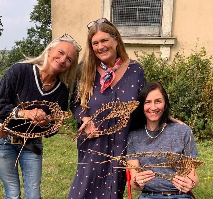 Three lasies holding willow art