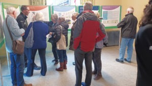 Residents discuss Local Plan proposals beside display boards at a public consultation event